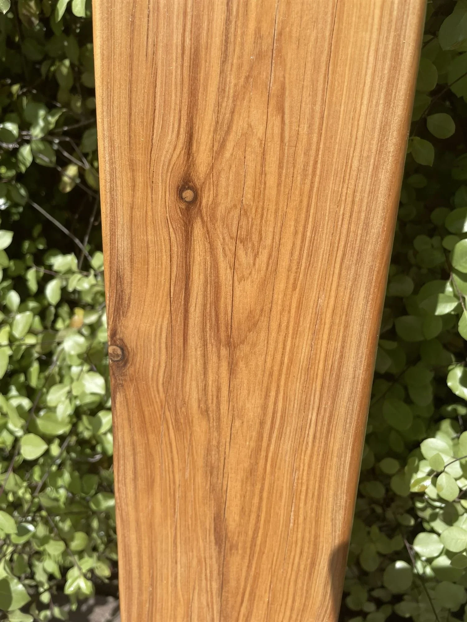 Pergola post finished with a clear exterior coating showing the timber grain