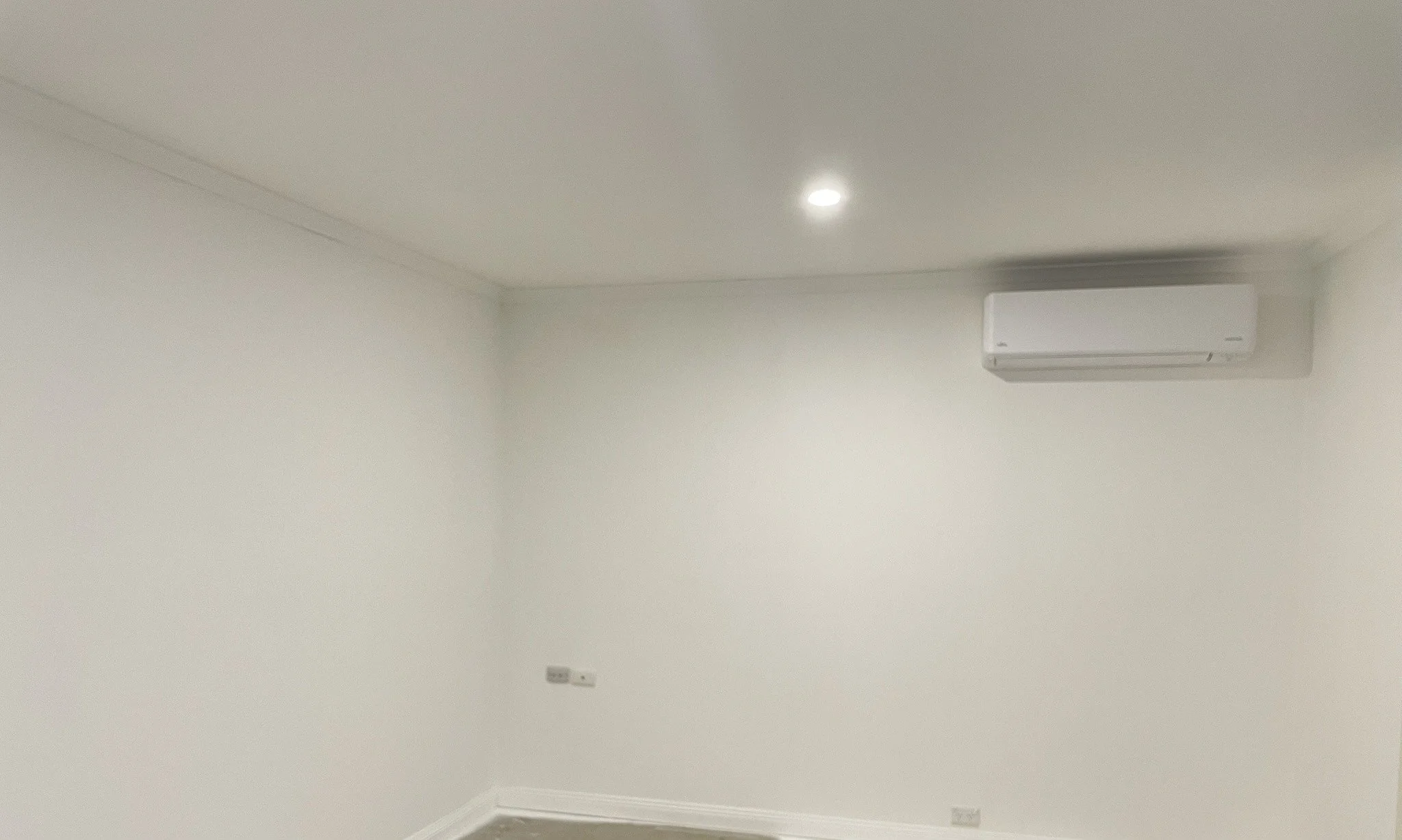 Crisp white painted bedroom corner with ceiling and cornice detail, Croydon