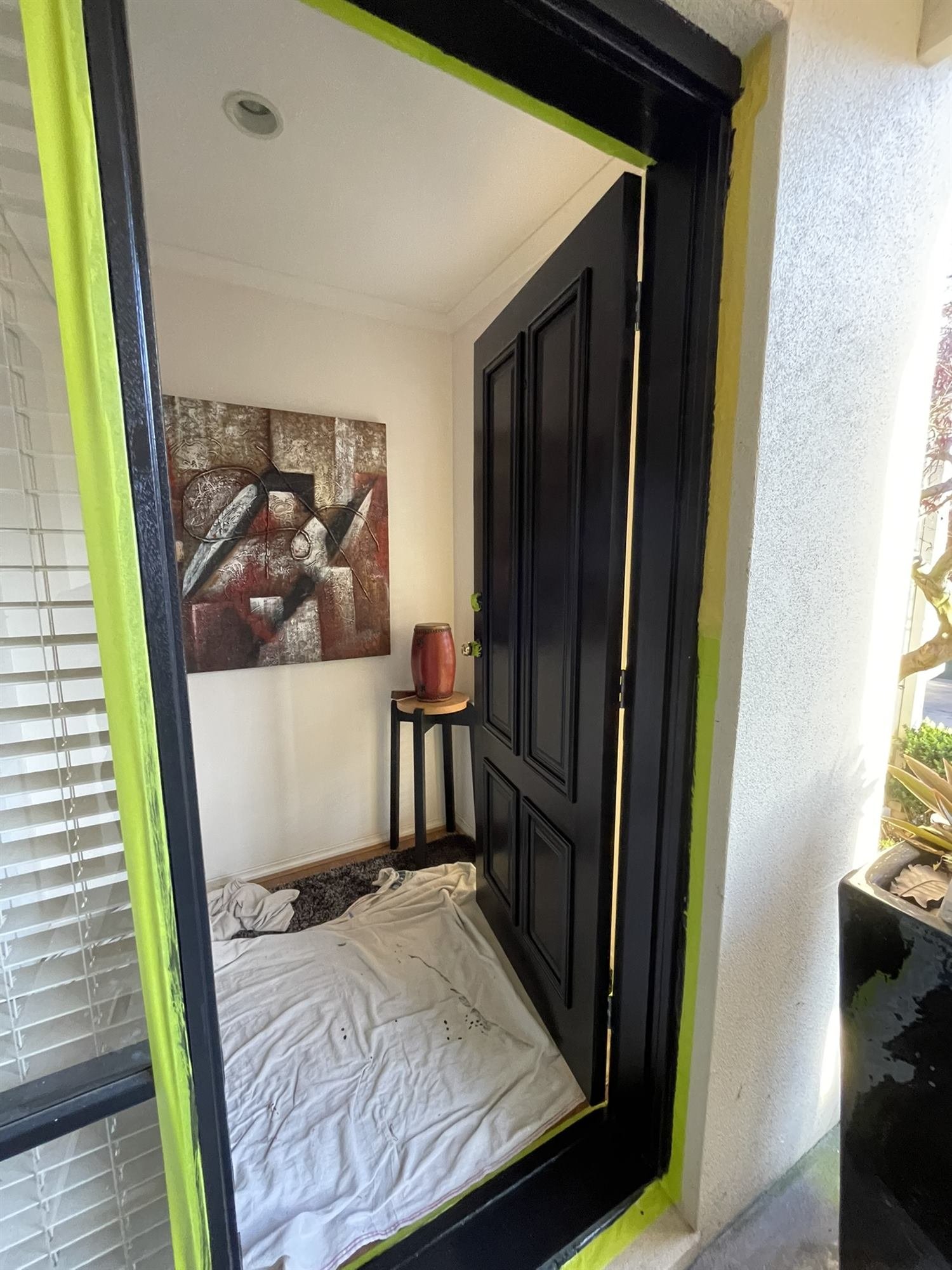 Front door and frame masked and repainted in black gloss, Croydon