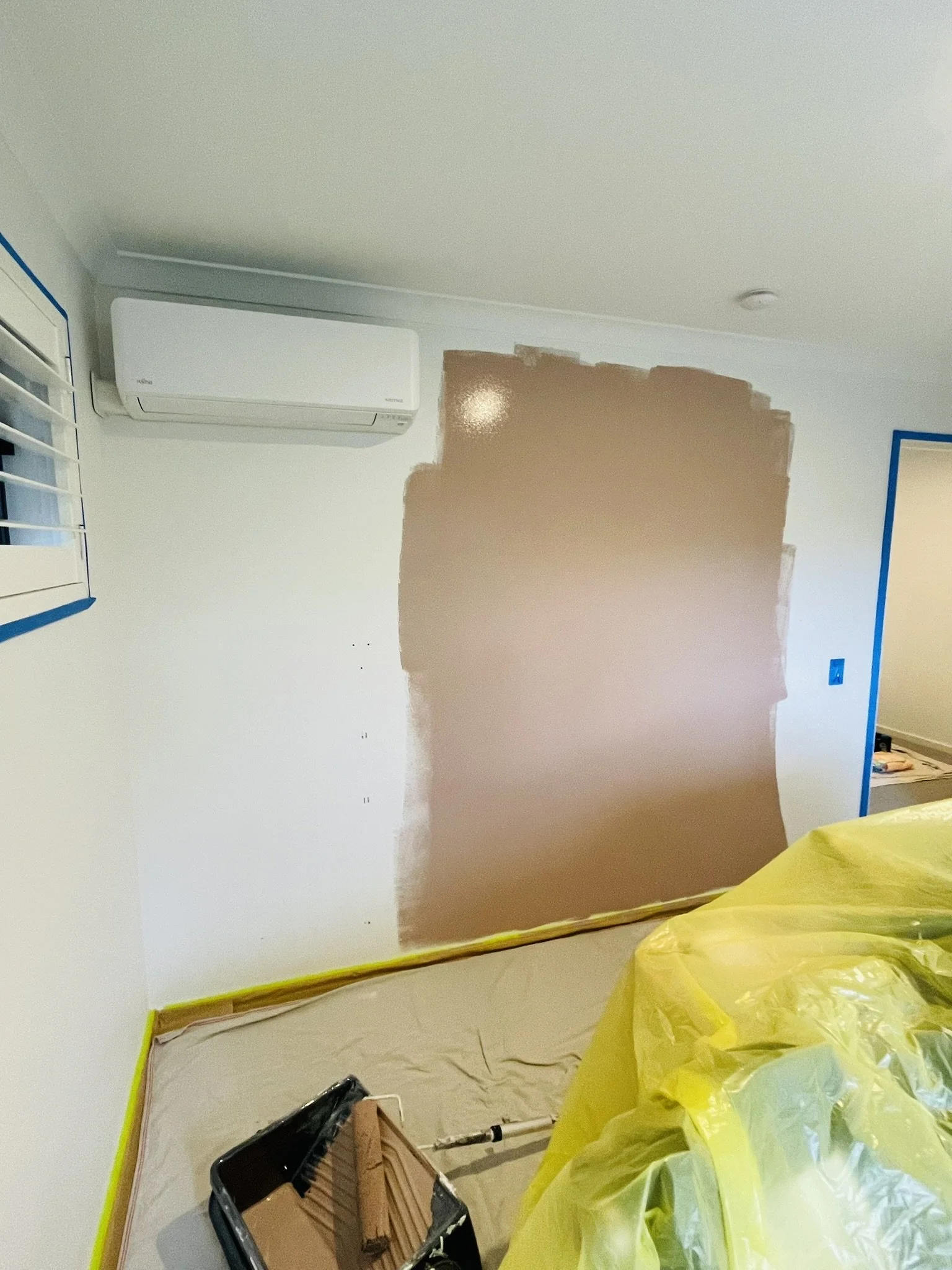 Tint Hygge feature wall colour being applied in a nursery