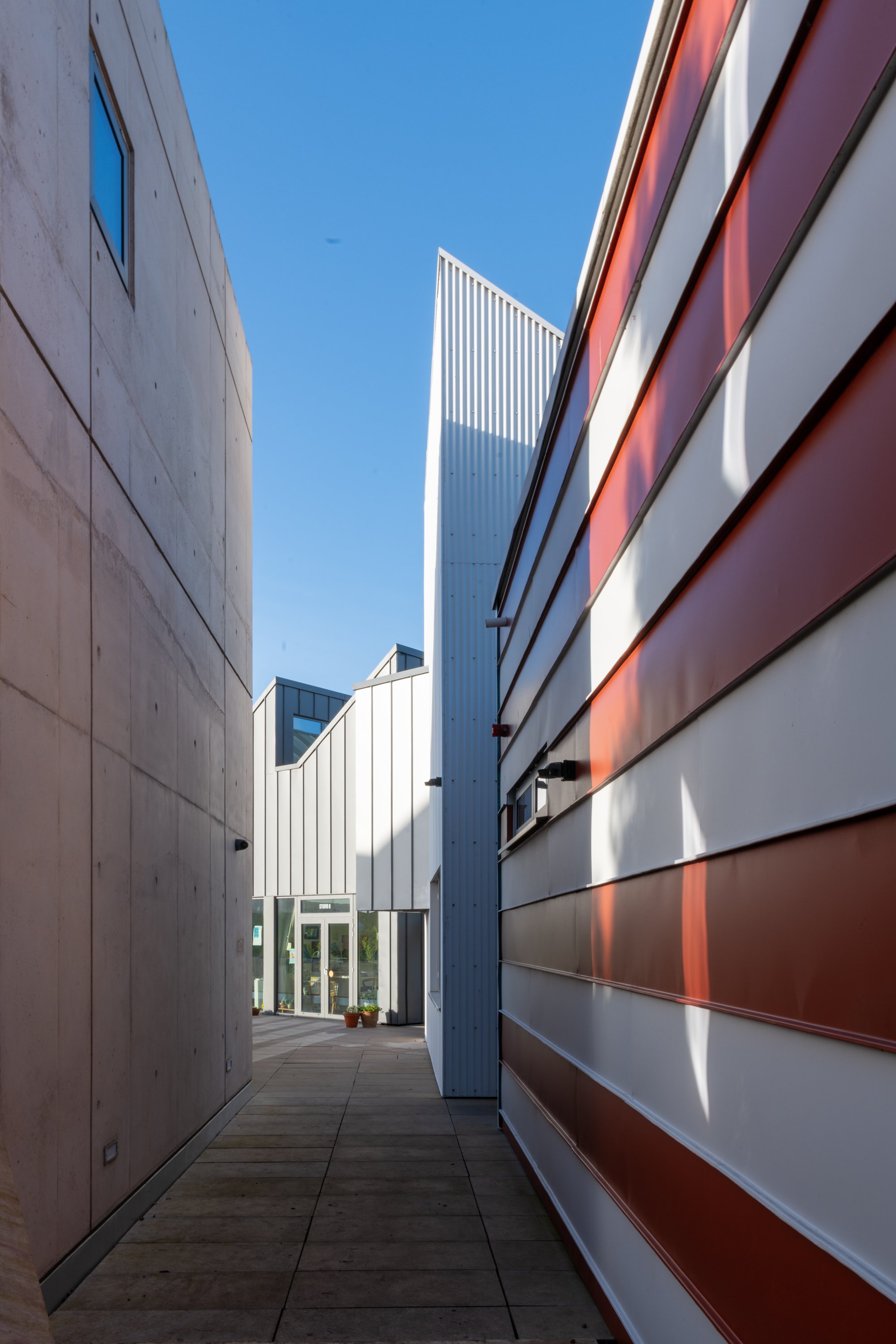 East Quay Watchet exterior view red and white cladding and concrete wall