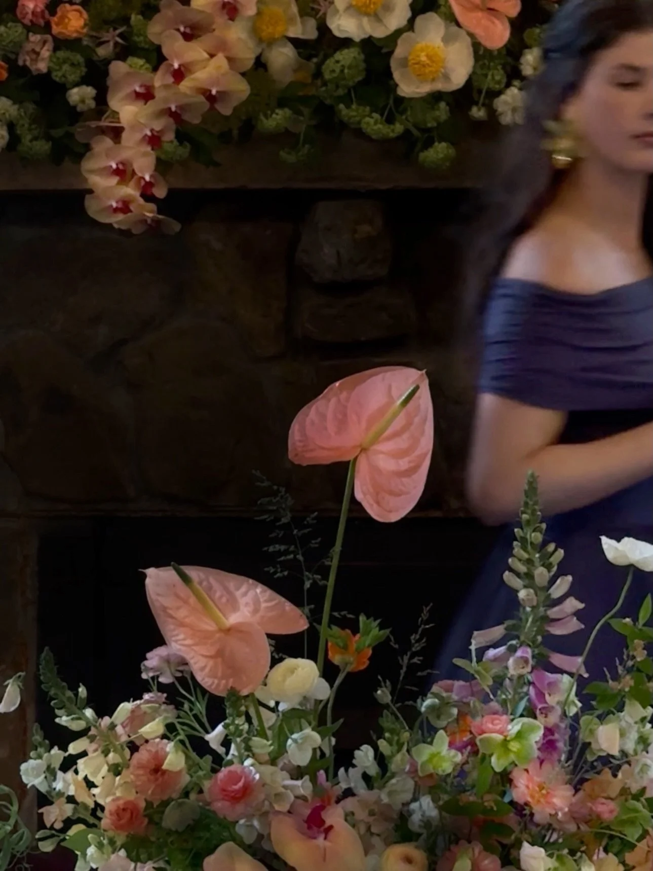 hellebores, sweet peas, anthurium, foxgloves, butterfly ranunculus, orchids&mdash;all my favorites layered into one centerpiece design