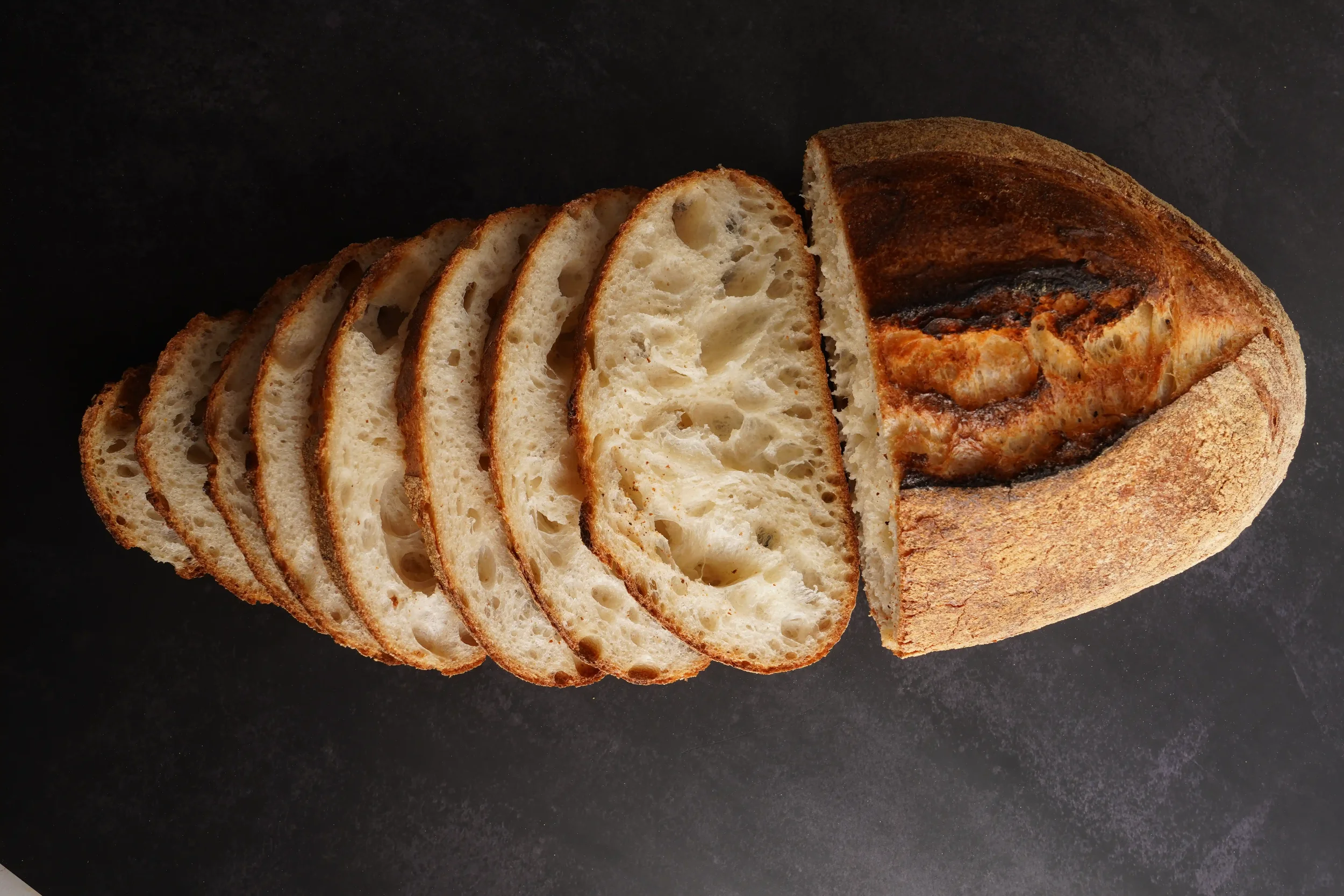 Freshly baked sourdough bread at Arwana Artisan Bakehouse, milled and baked in-house, Riyadh