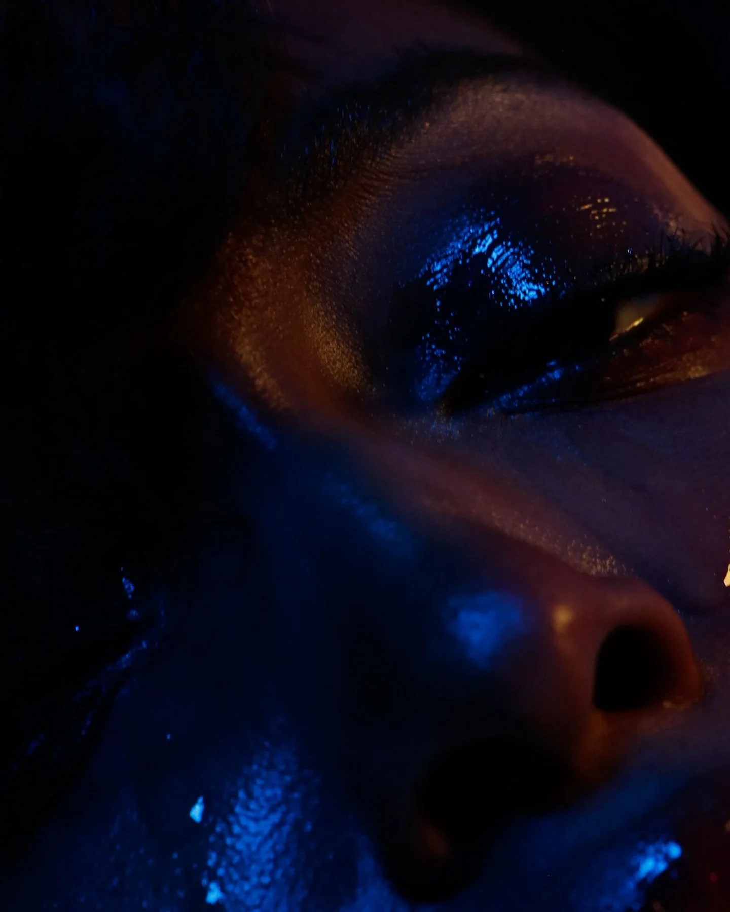 Beneath the glow, I unravel. 
Vulnerability drips down my skin like a confession, too raw to hold back. 
I reach &mdash;
desperate, hollow &mdash;
only to find the air colder than the silence. Touch feels foreign, love feels distant, and yet I linger