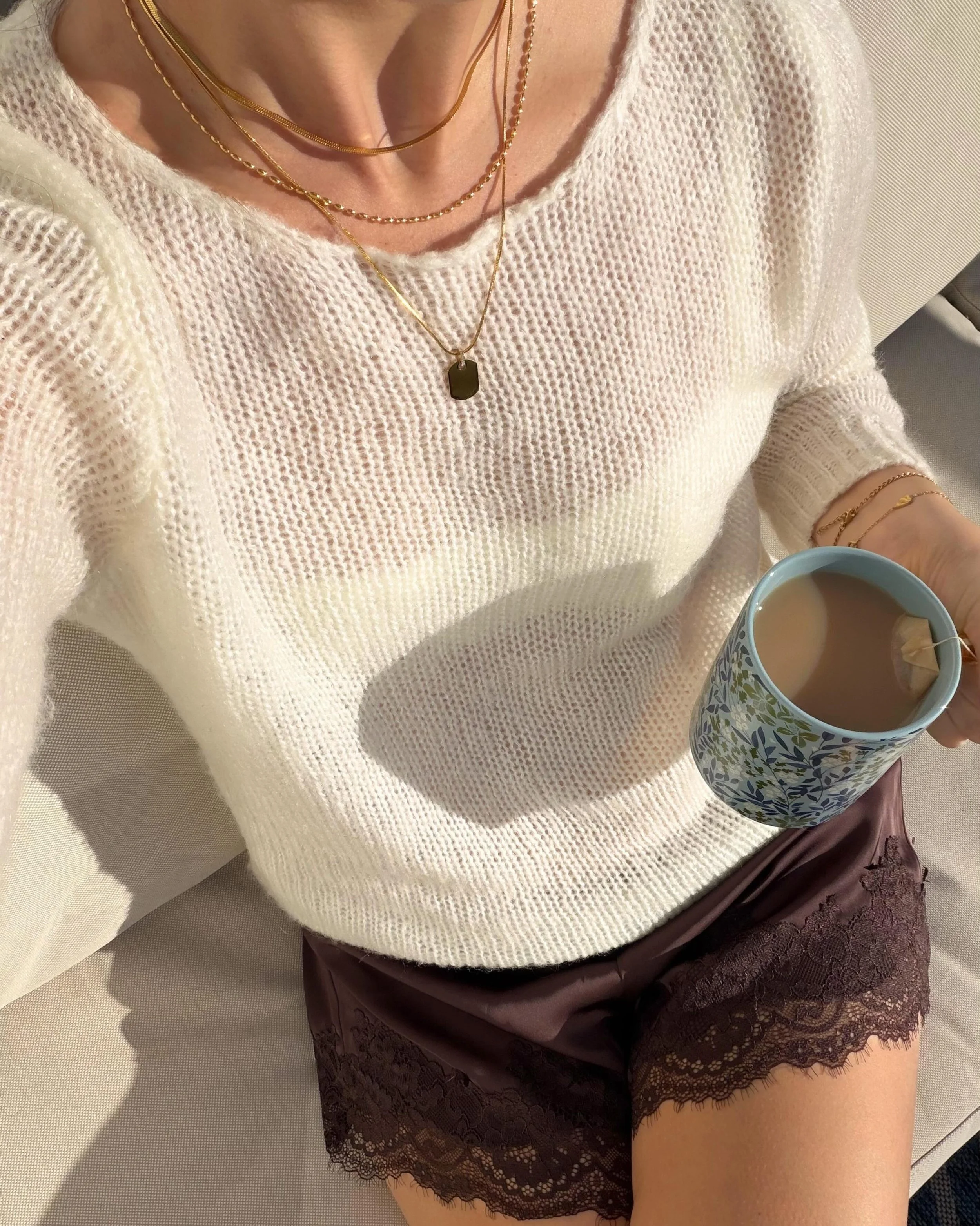 Current obsession: waterproof gold layers and slow mornings ☁️✨