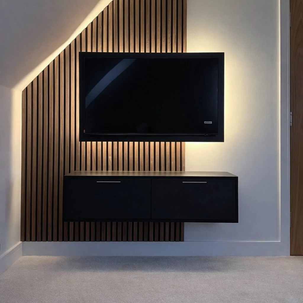 The perfect little corner for a sleek tv &amp; gaming area 🕹️! We fitted a bespoke floating media cupboard to house the gaming console, then added some acoustic panelling from @woodupp_com to the space. Finally we projected the television forward on