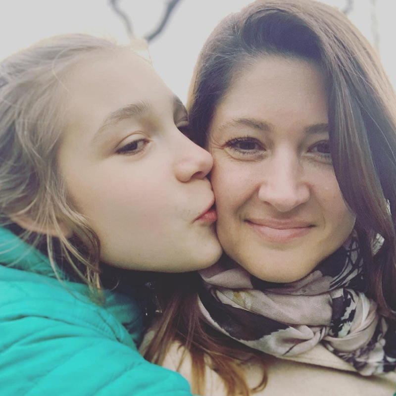 Sacha giving a kiss on the cheek to his mother Elise