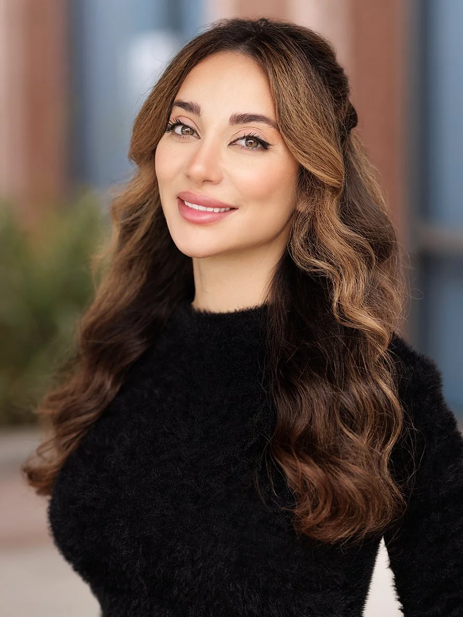 Professional business headshot of a confident woman photographed in natural light with a clean, modern aesthetic. This fresh, polished corporate portrait is ideal for executive profiles, personal branding, LinkedIn headshots, and company websites. Th