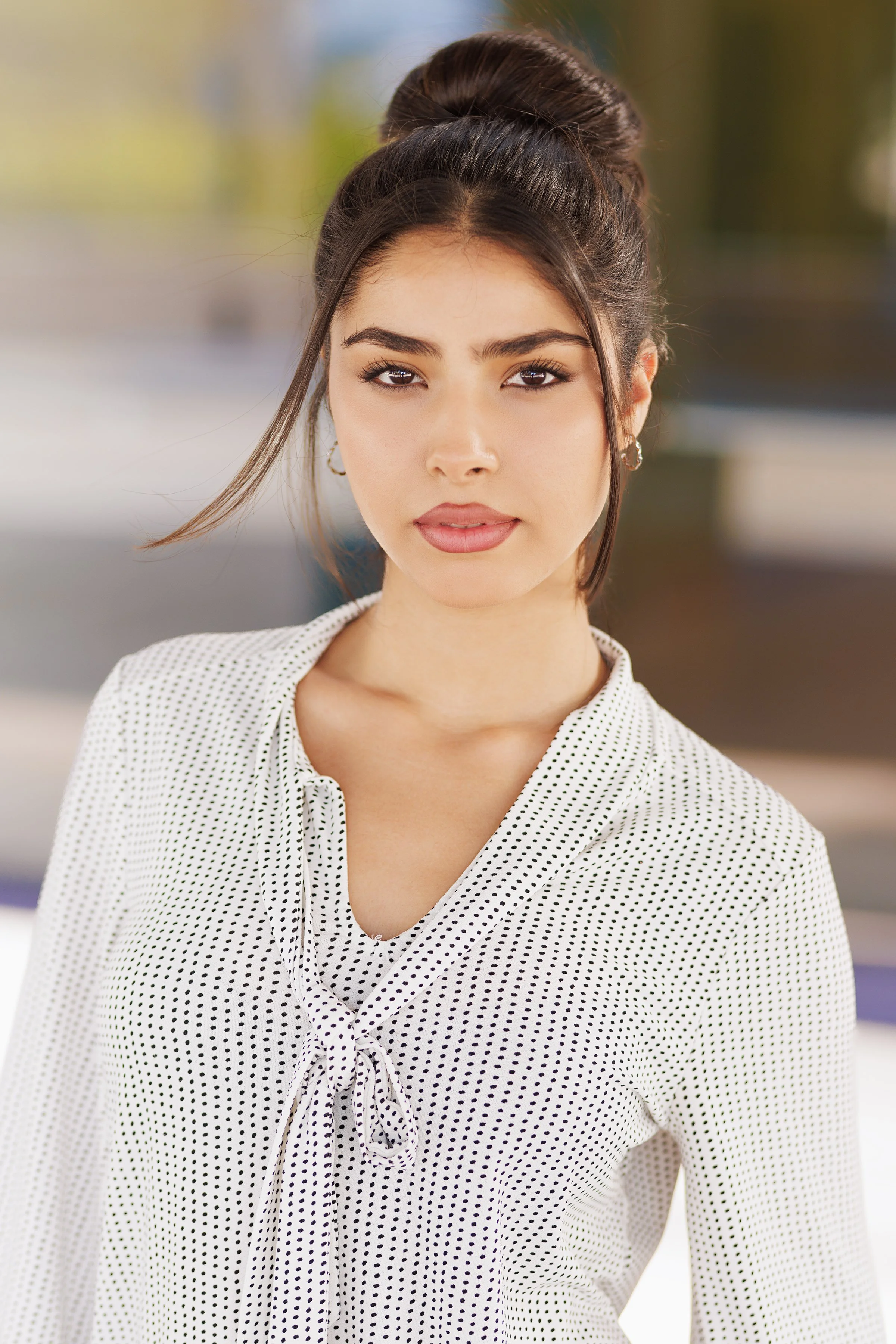 An elevated editorial headshot featuring the actor with slicked-back hair, styled for a bold, high-fashion aesthetic. Captured with sculpted lighting and sharp contrast, the expression is confident and commanding — ideal for fashion campaigns, luxury