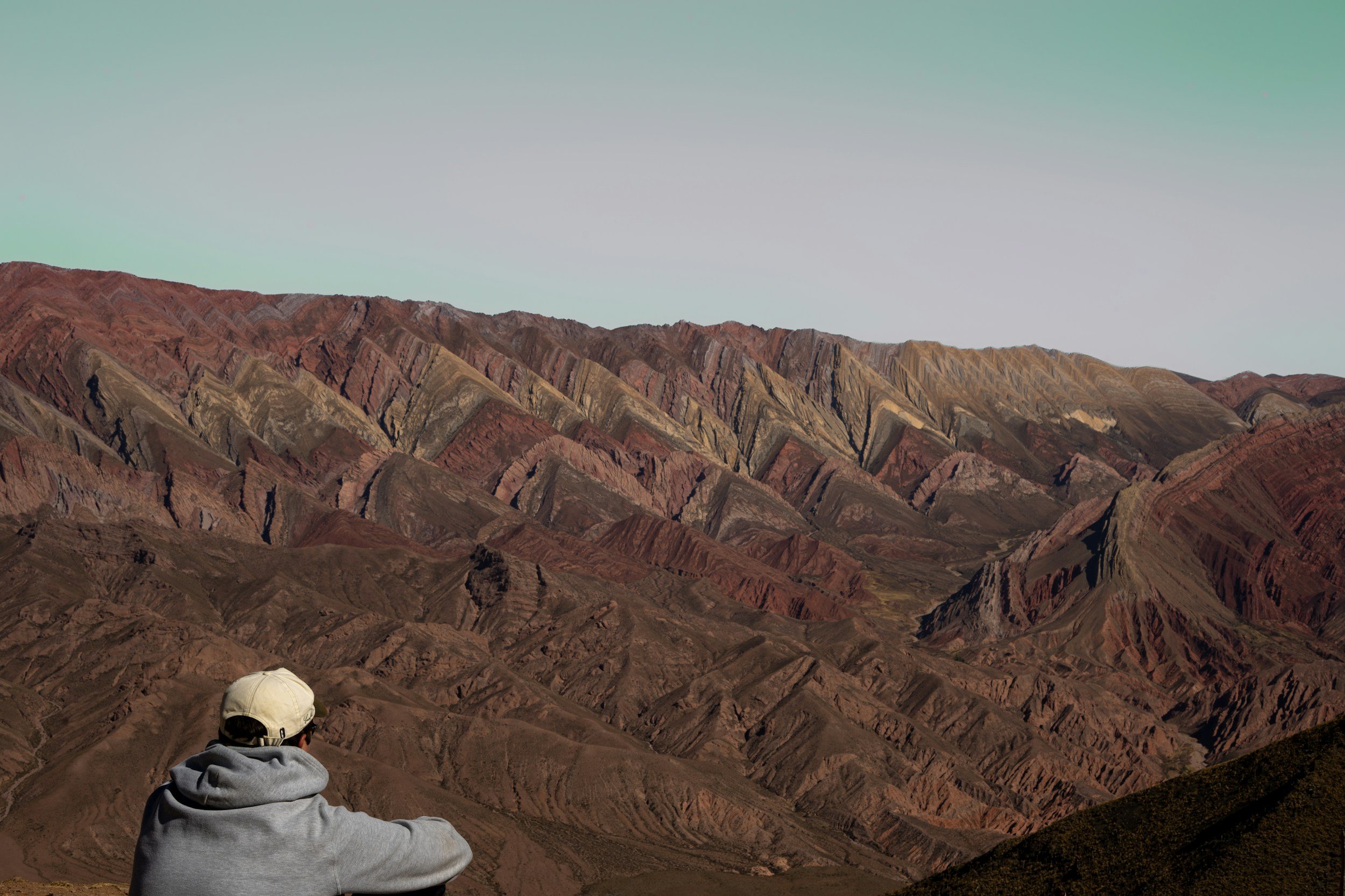 Person walking thoughtfully, reflecting on emotional overwhelm and nervous system fatigue