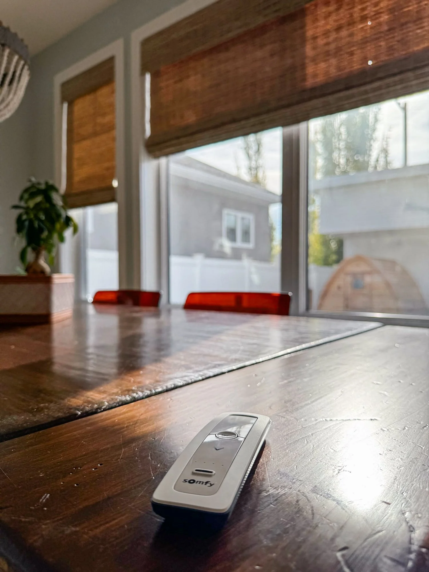 coastal-house-motorized-shade-remote.jpg