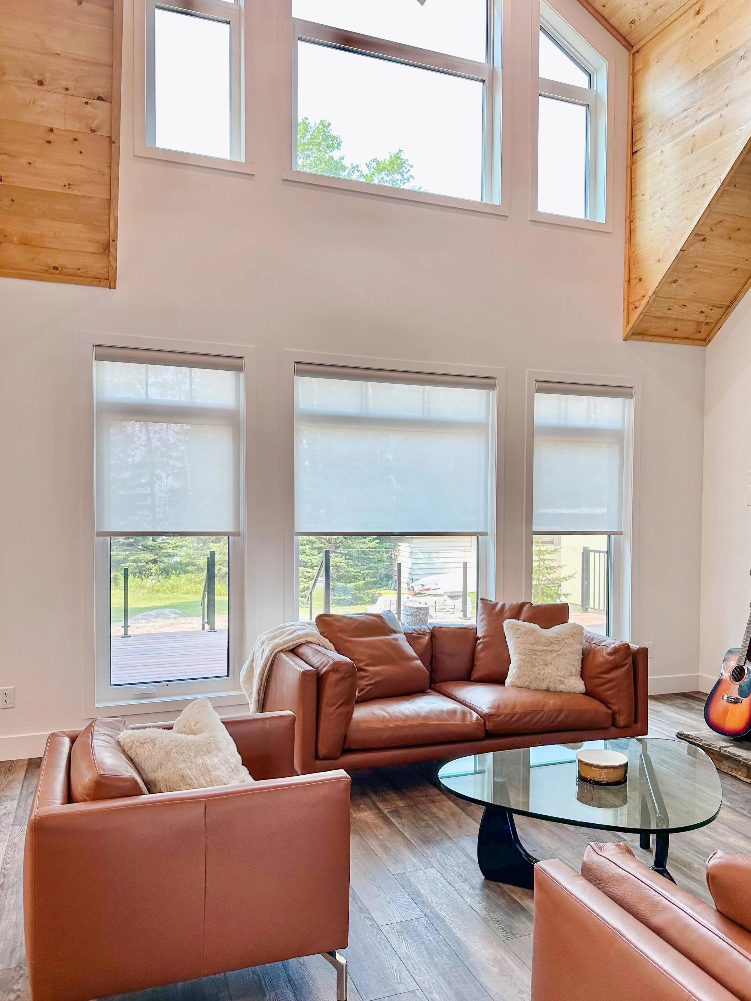 This Candle Lake cabin casually slipped into quiet luxury after we installed these roller blinds✨

Natural light, warm textures &amp; shades that soften the space without stealing the view. 

&hellip; Because the best rooms don&rsquo;t scream for att