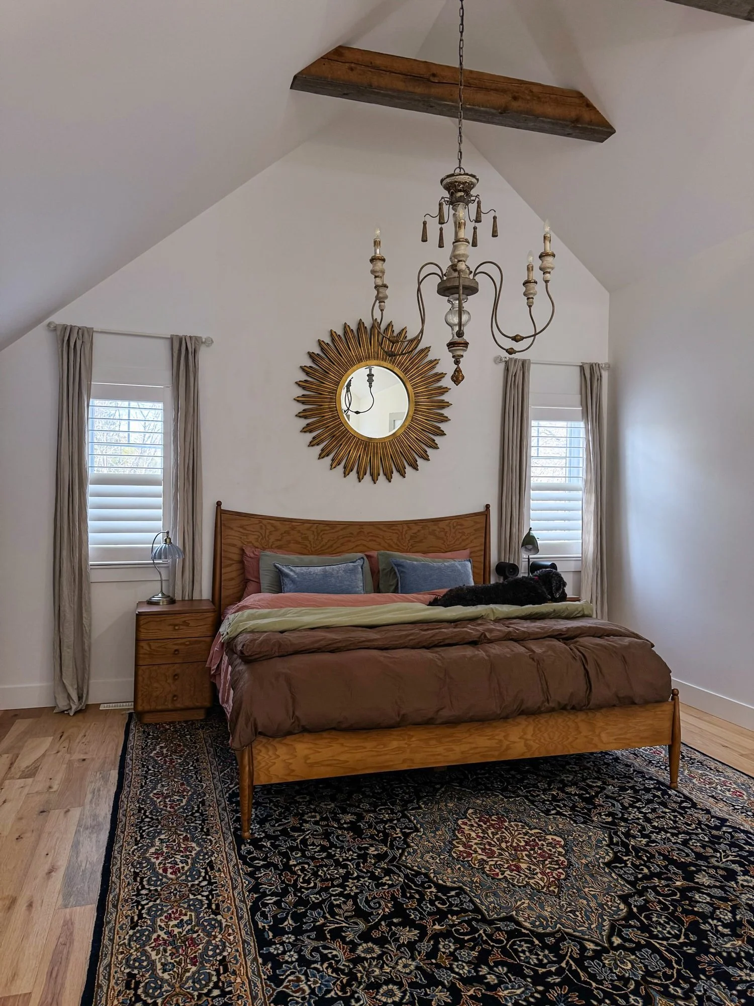 coastal-house-primary-bedroom-poly-shutters.jpg