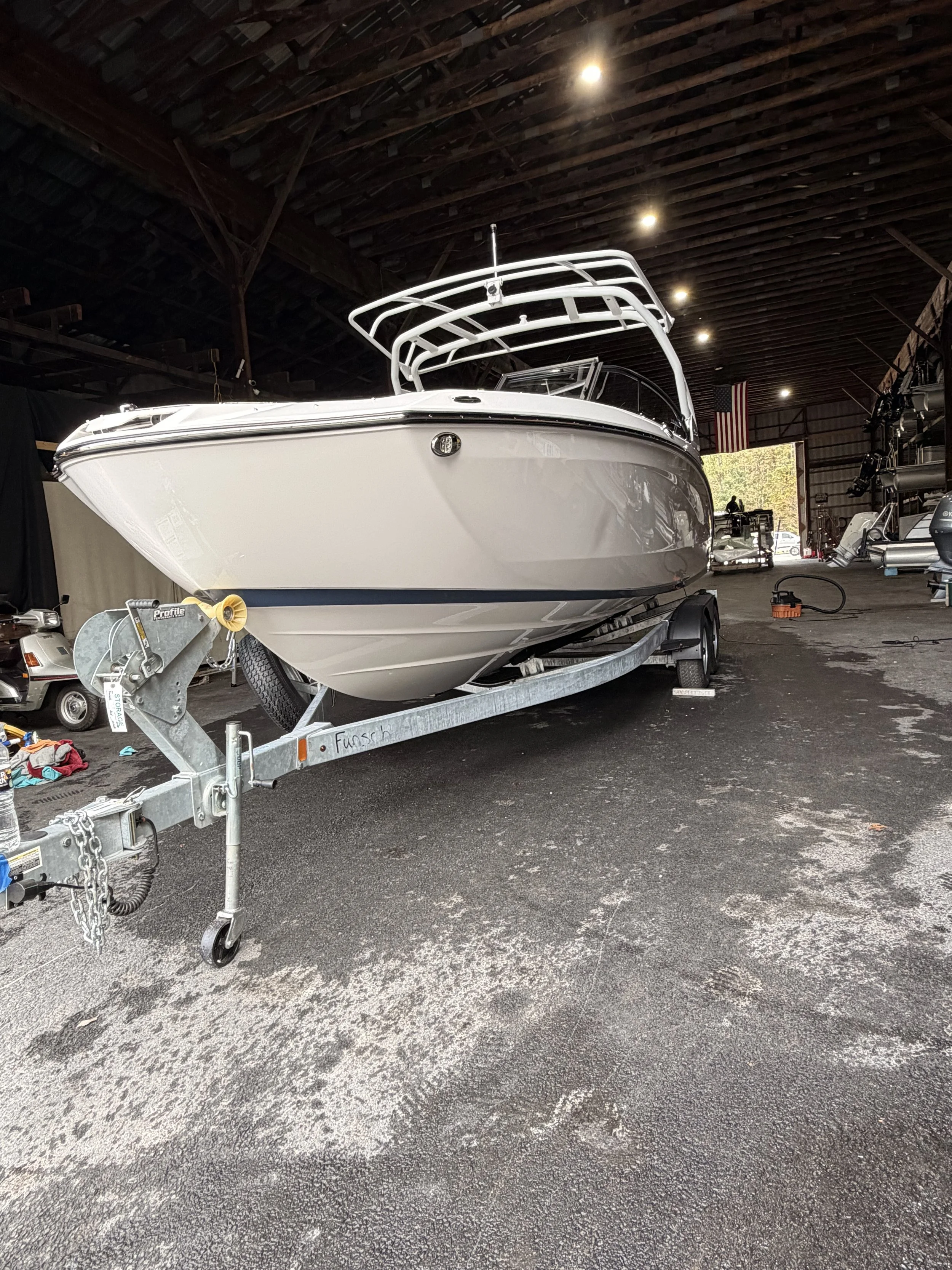 white motorboat detailed at Private’s Cove Marina Lake Wallenpaupack PA indoor service