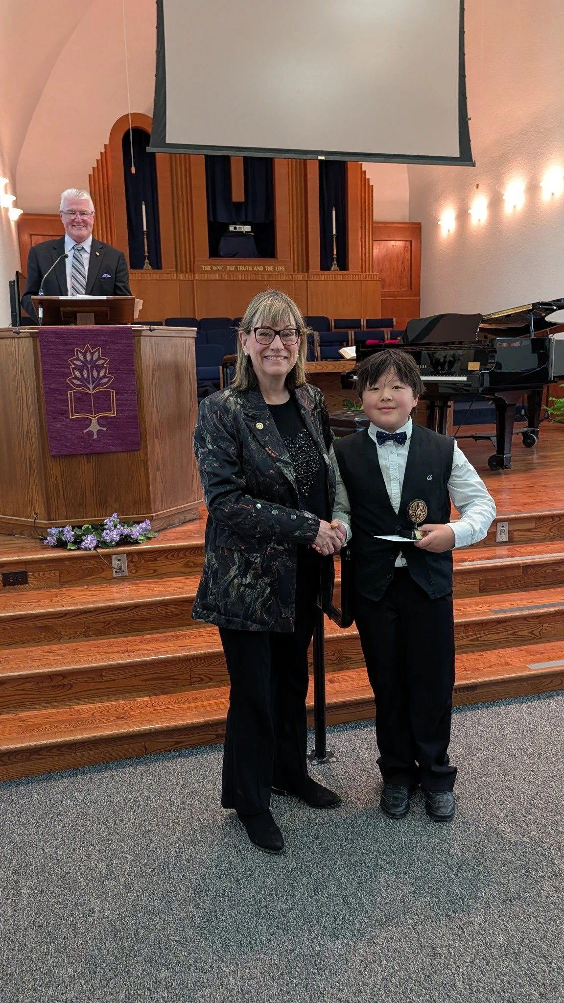 Ethan winning cash award at Quinte Rotary Star Concert