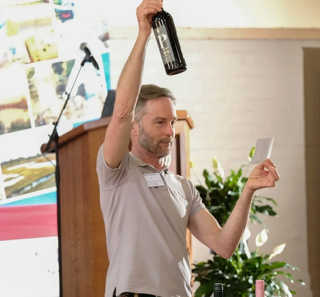  Roger Diamond, BIOGRIP Director, lays down the rules for the fun competition to guess the stable oxygen isotope composition of various wines. 