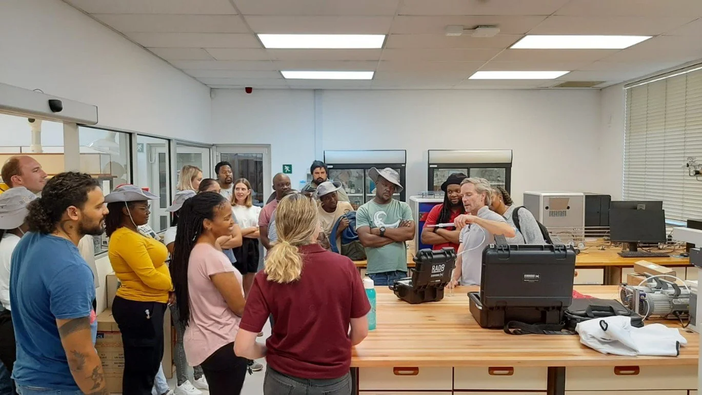 Dr Roger Diamond demonstrating the use of the RAD8 radon meter with a sample taken only minutes before from a borehole nearby on campus. 