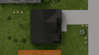 A house with a dark roof, surrounded by a lawn, a gray driveway, and some garden plants.