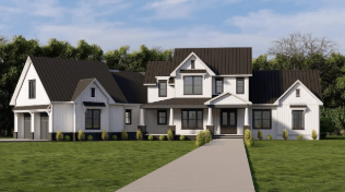 Large modern farmhouse-style house with white exterior, black roof, multiple gables, and a front walkway, surrounded by green lawn and trees in the background.