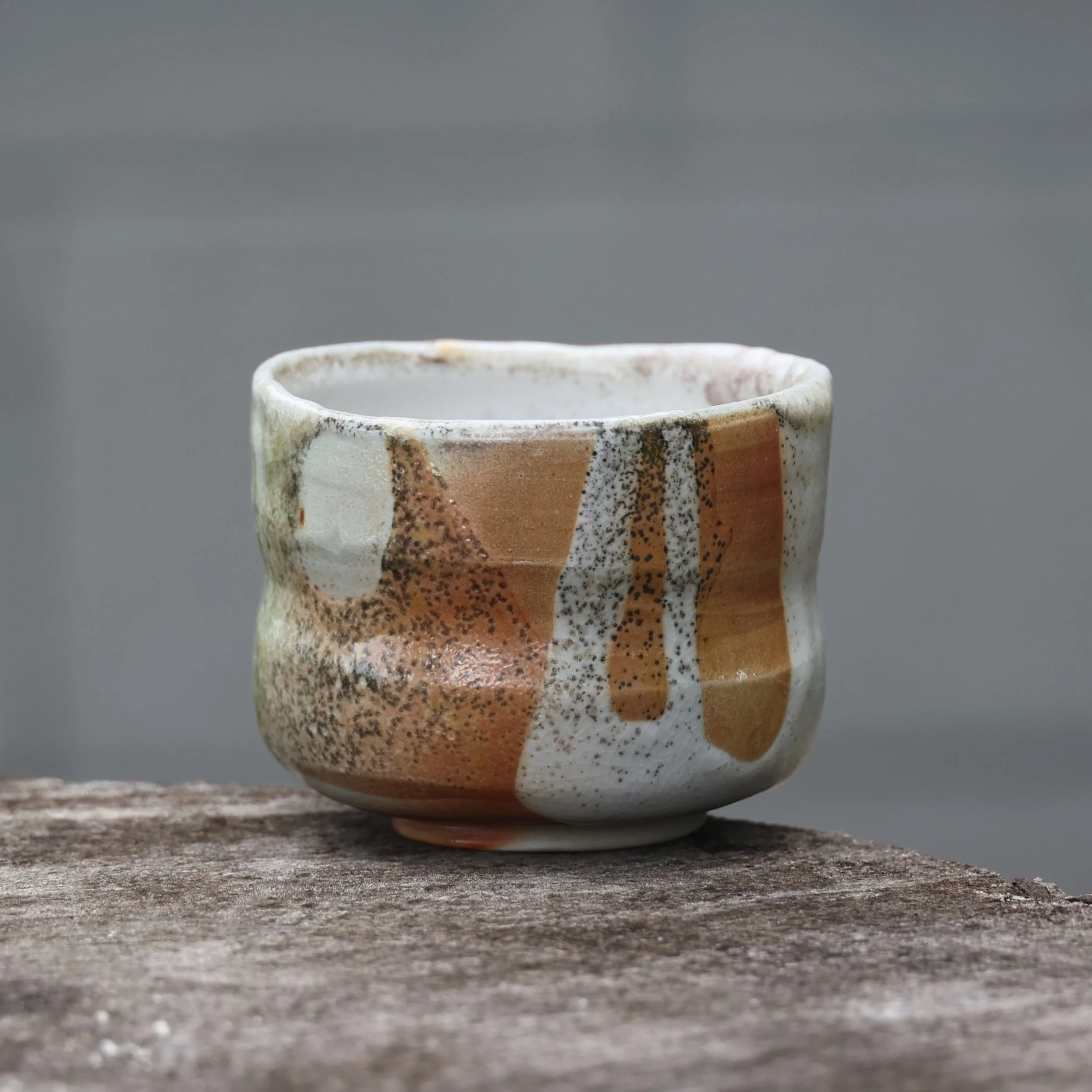 Wood-fired porcelain tea bowl. A farorite from our recent firing. I made this back in May to be fired in a different kiln and it didn't get in for whatever reason. This time it got in. 

I have been trying some subtle brushwork with red iron oxide sl