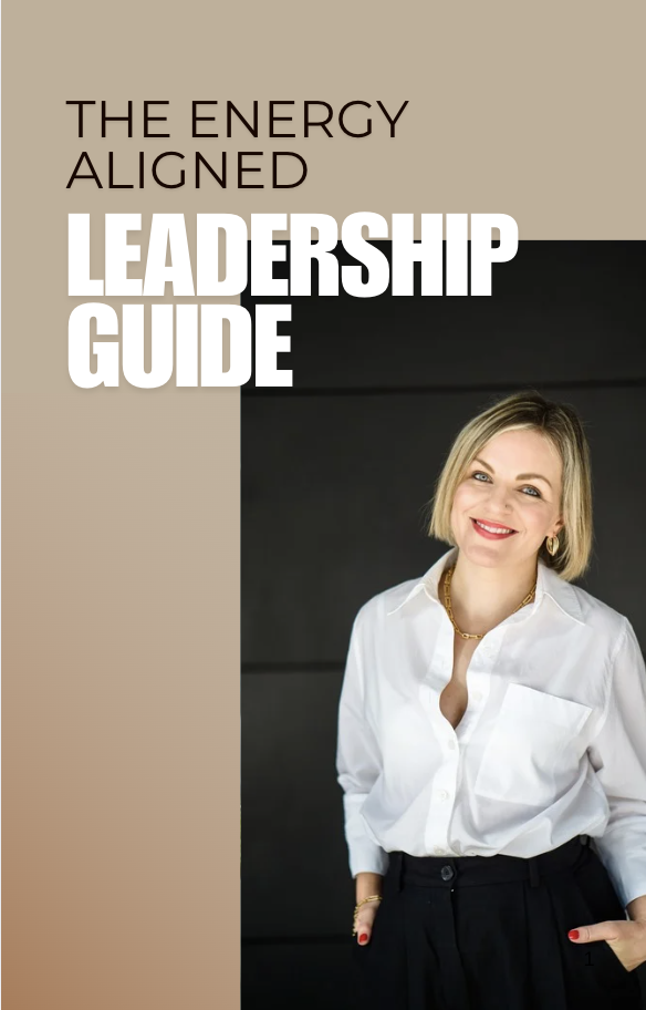 A smiling woman in a white shirt stands against a dark background. Text reads "The Energy Aligned Leadership Guide."
