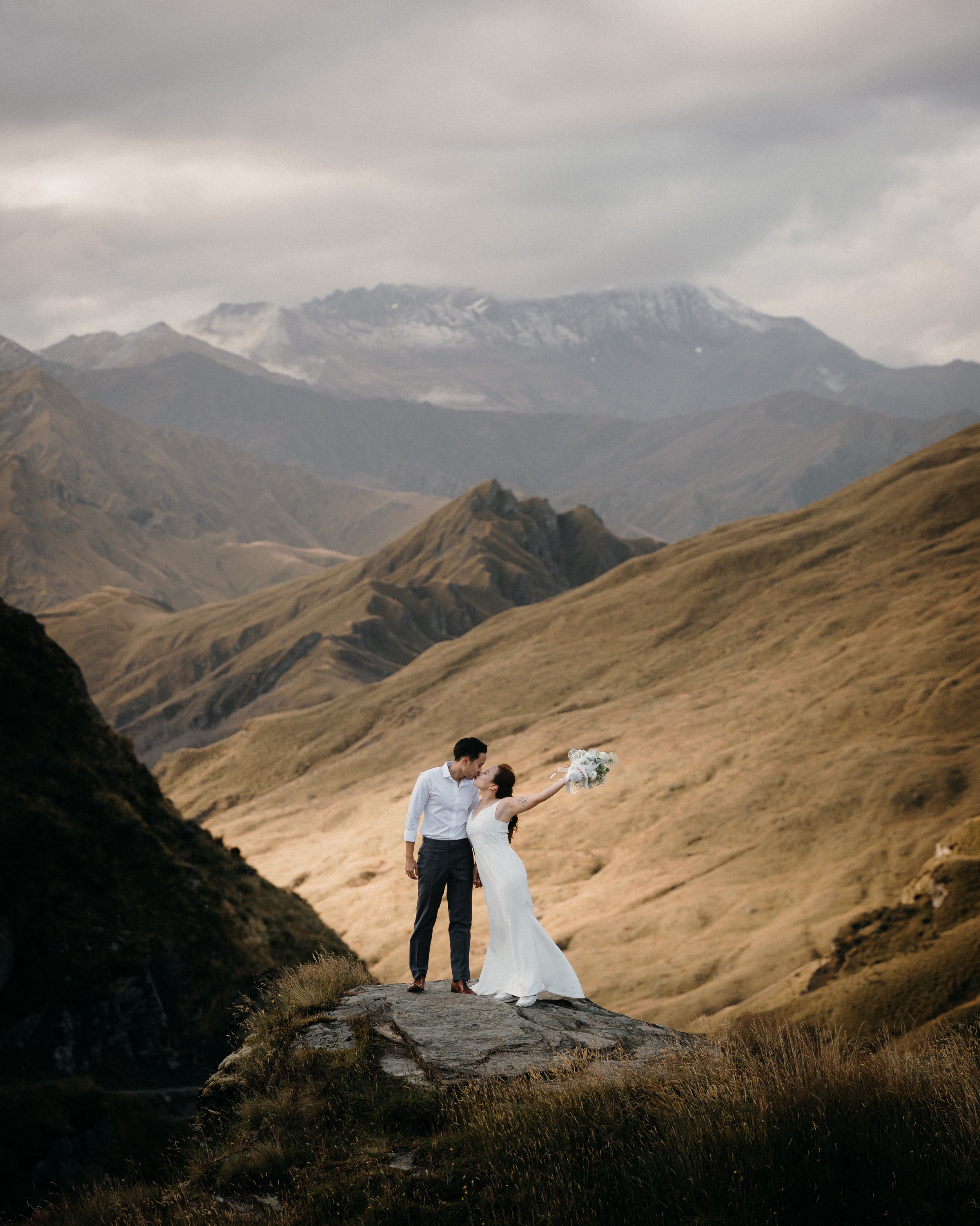 Bride celebrating her destination elopement in Skippers Canyon Queenstown. Couple got married with Will Love Elopements in New Zealand
