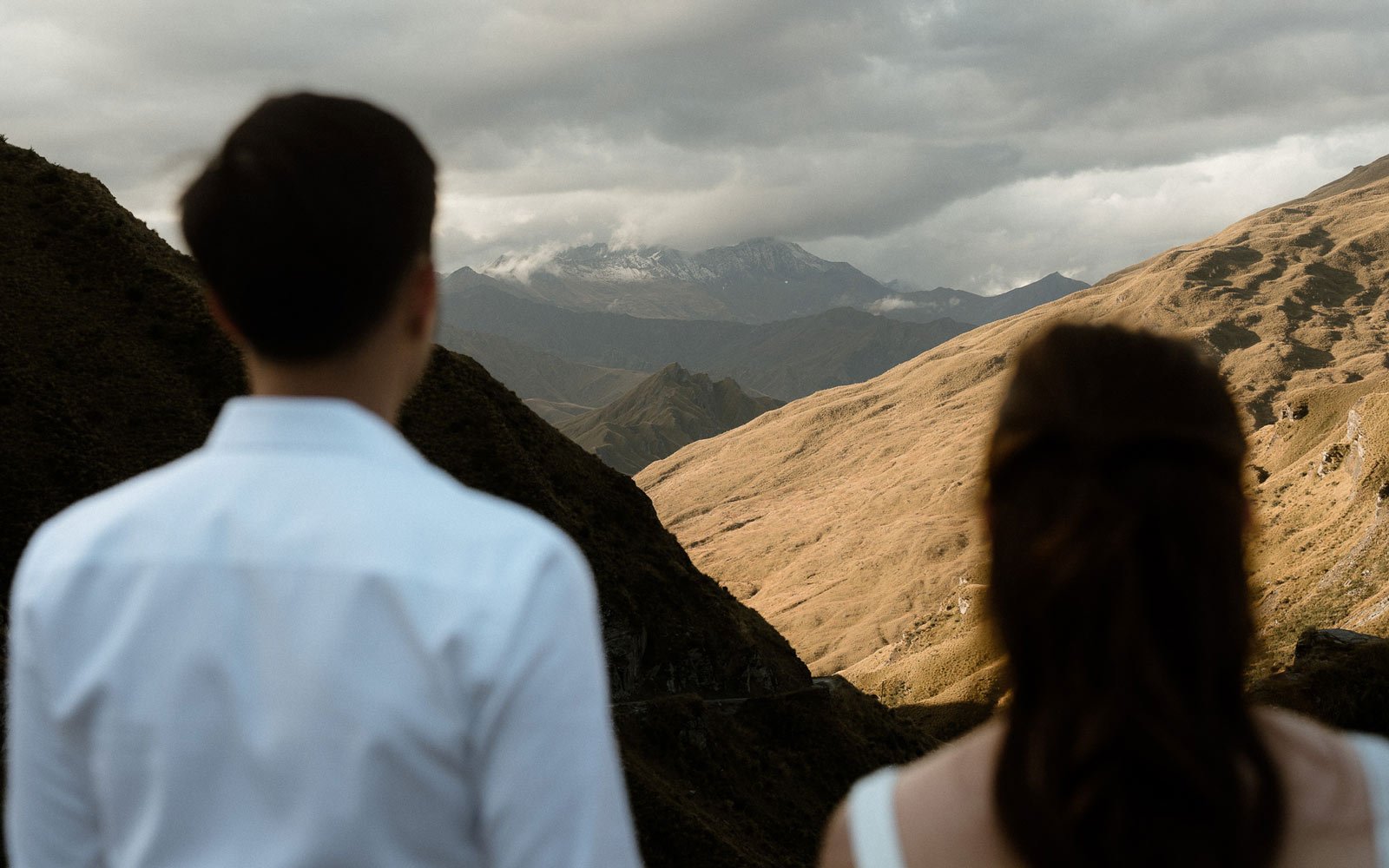 Couple looking at sunset over Queenstown Skippers canyon