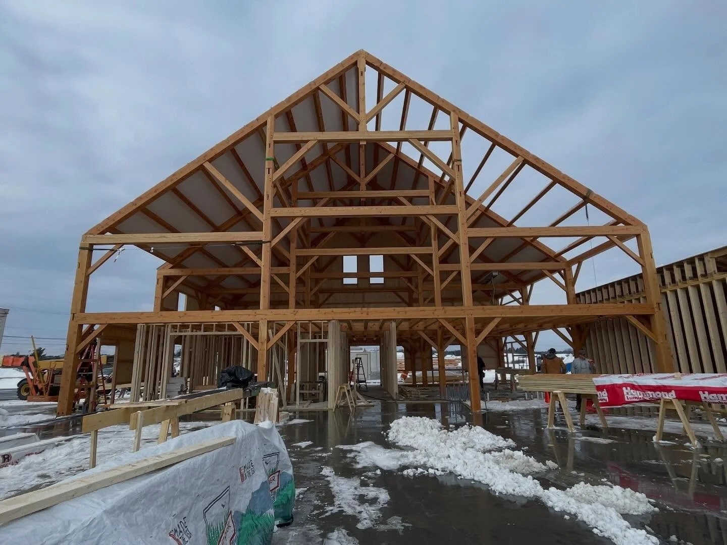 Winter won&rsquo;t stop this fine timber frame structure from going up. The future Cherry Hill Barn in Gorham will offer up quite the community space. @shaw_brothers_construction @vikinglumber @krouse_timber_frames #timberframe #wood