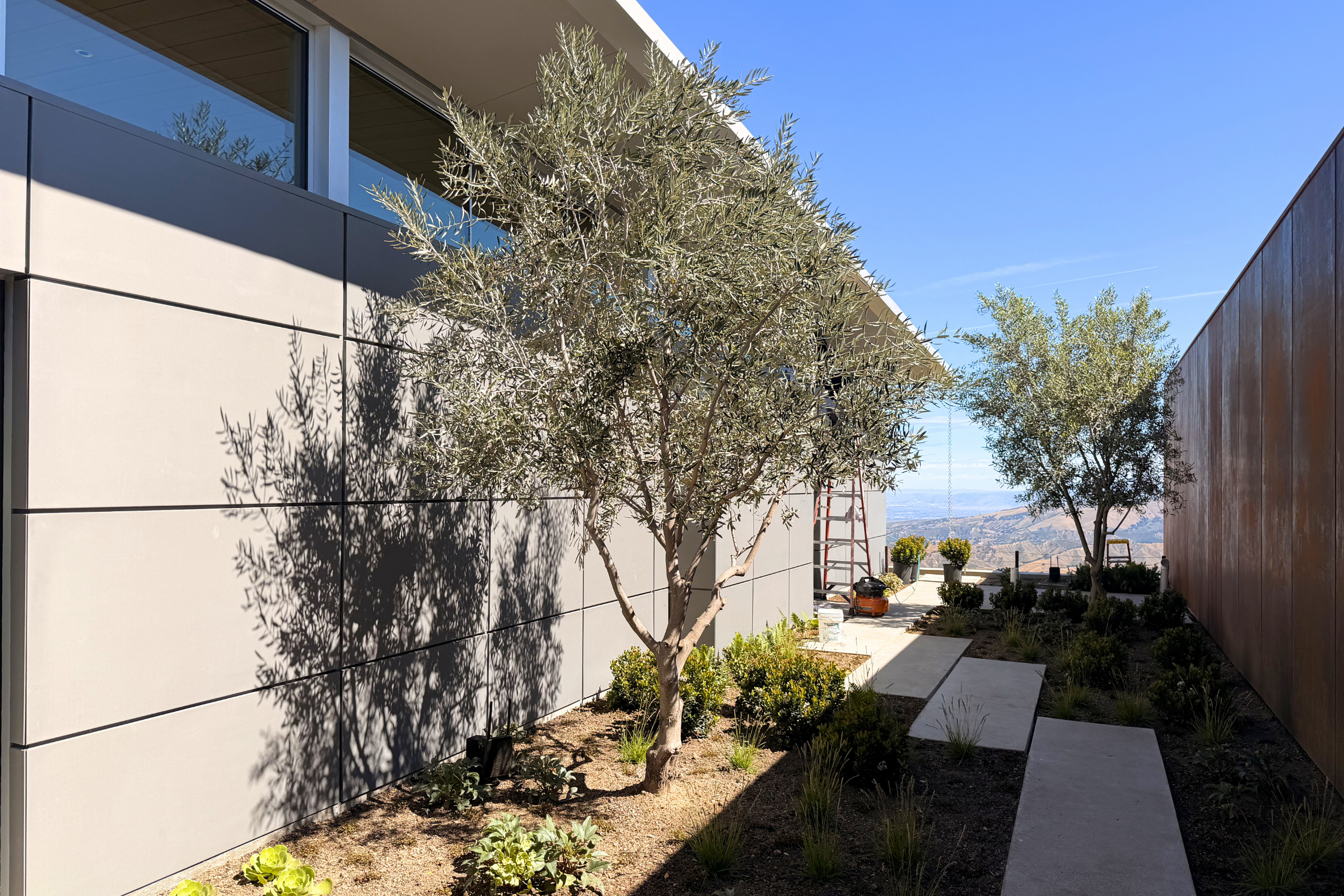 Custom architectural sheet metal wall panels installed on a modern home in Carmel Valley, CA