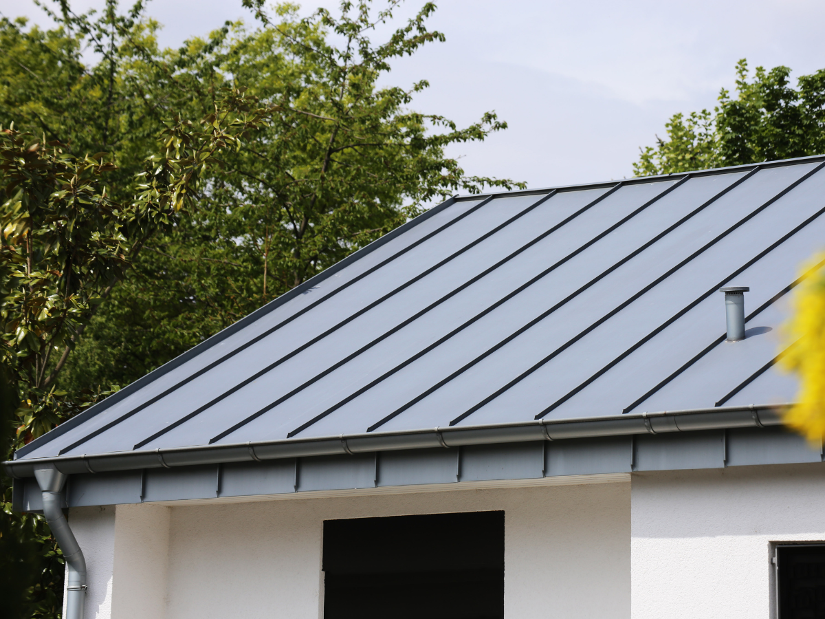 Standing-seam metal roof on a California home surrounded by trees