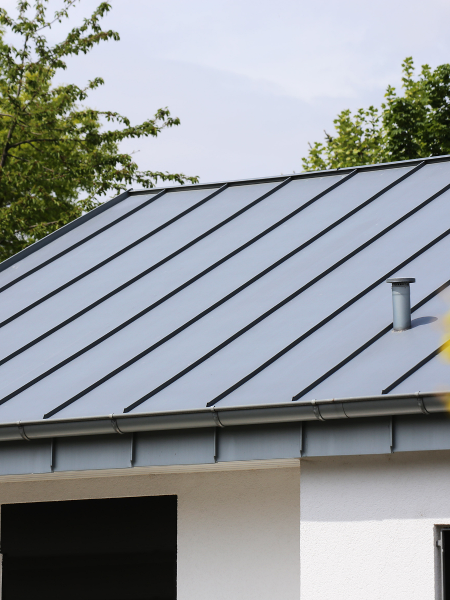 Standing seam metal roof with matching gutters