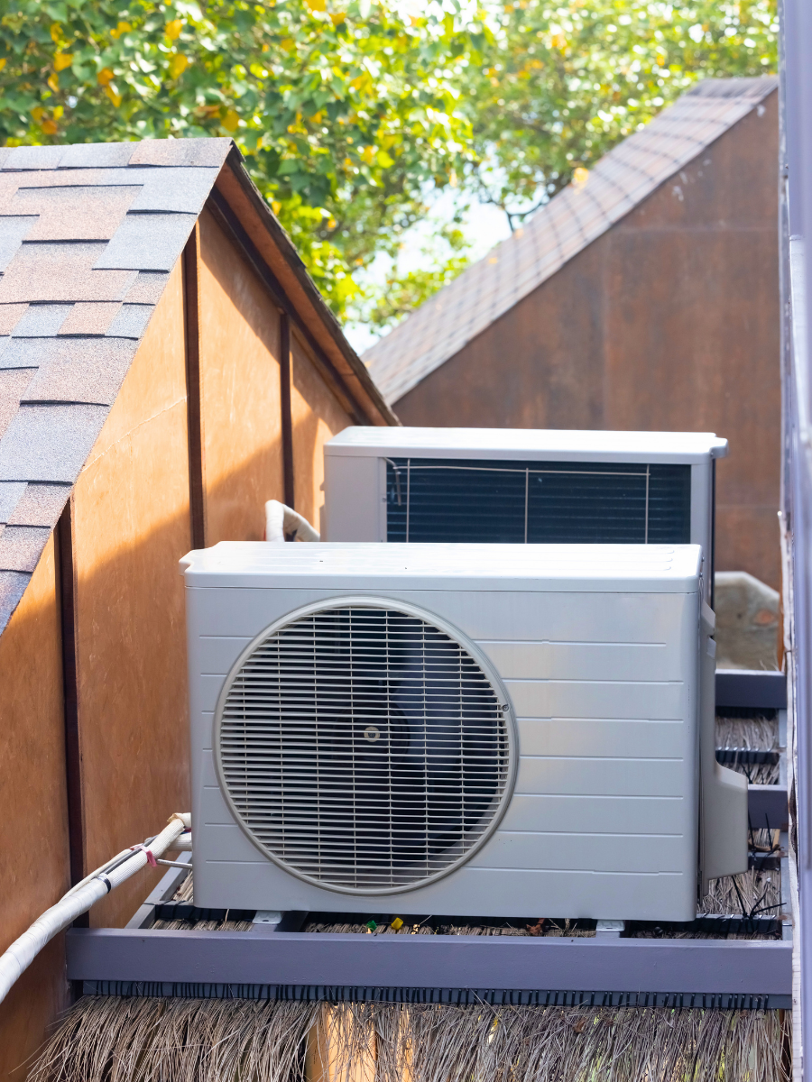 Outdoor ductless mini-split heat pump installed beside a home
