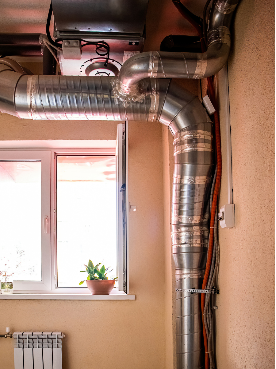 Exposed metal HVAC ductwork installed inside a residential property