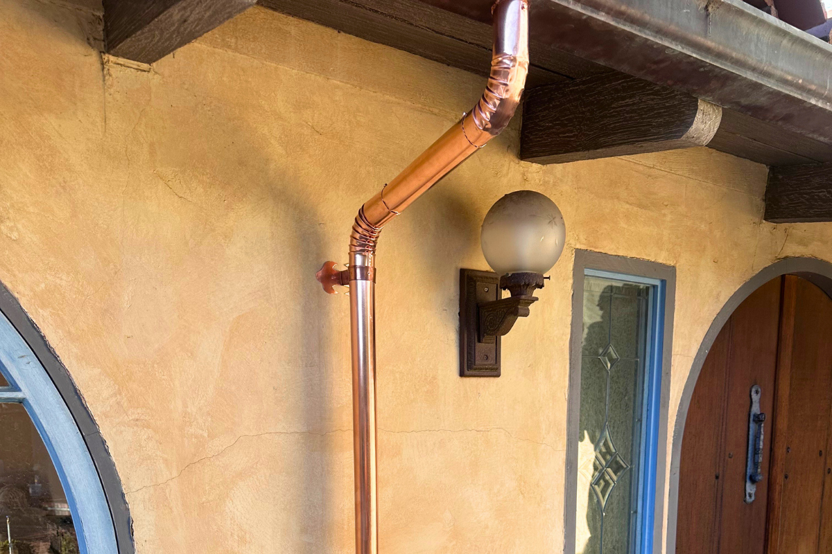 New copper gutter and downspout installation on a residential home in Carmel Valley California