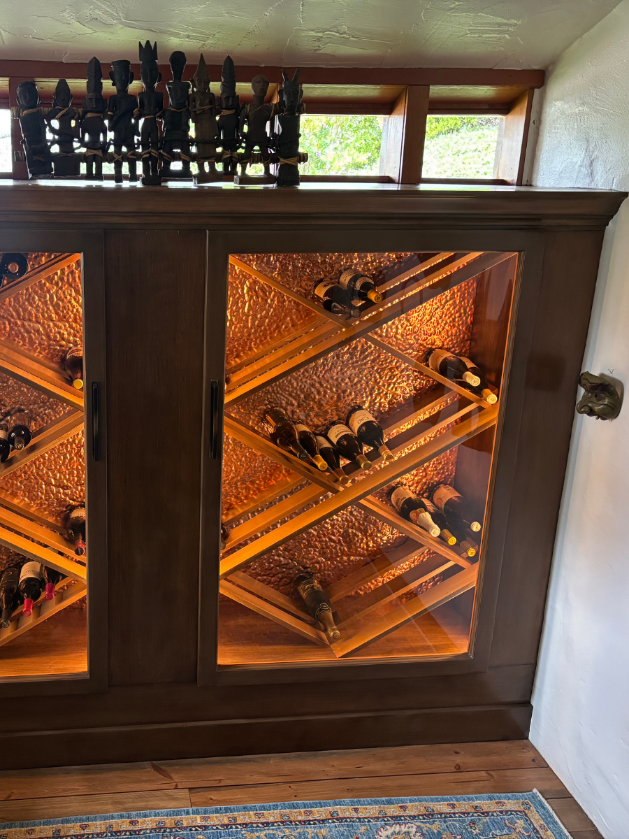Custom wine cabinet with hammered copper panels