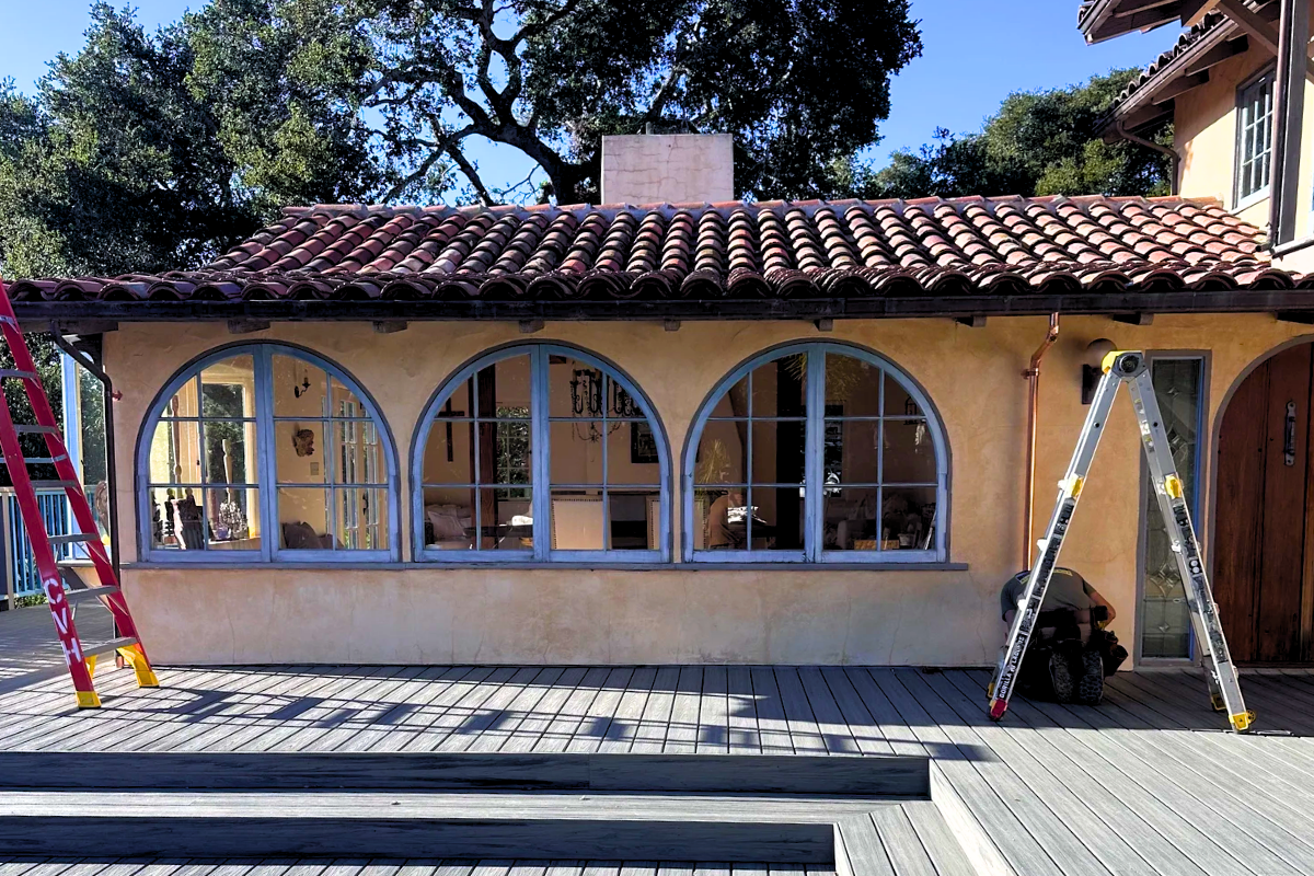 Spanish-style residential home exterior undergoing renovation in Carmel Valley California