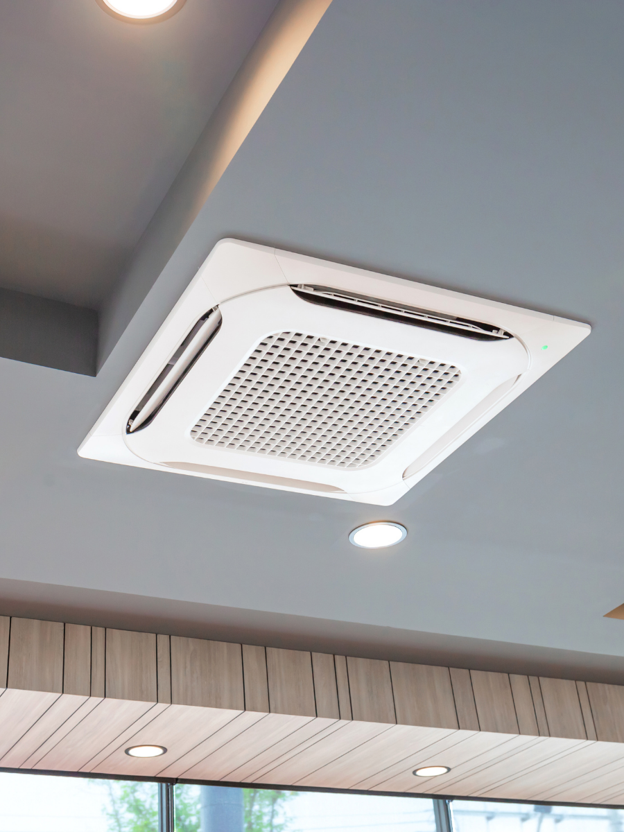 Ceiling-mounted ductless mini-split cassette installed indoors