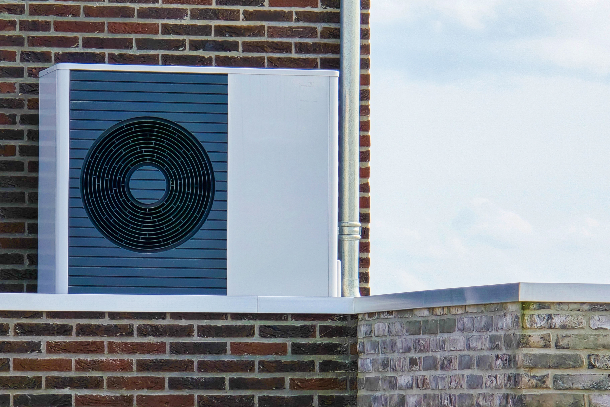 High efficiency residential air conditioning unit installed on an exterior wall in Carmel Valley California