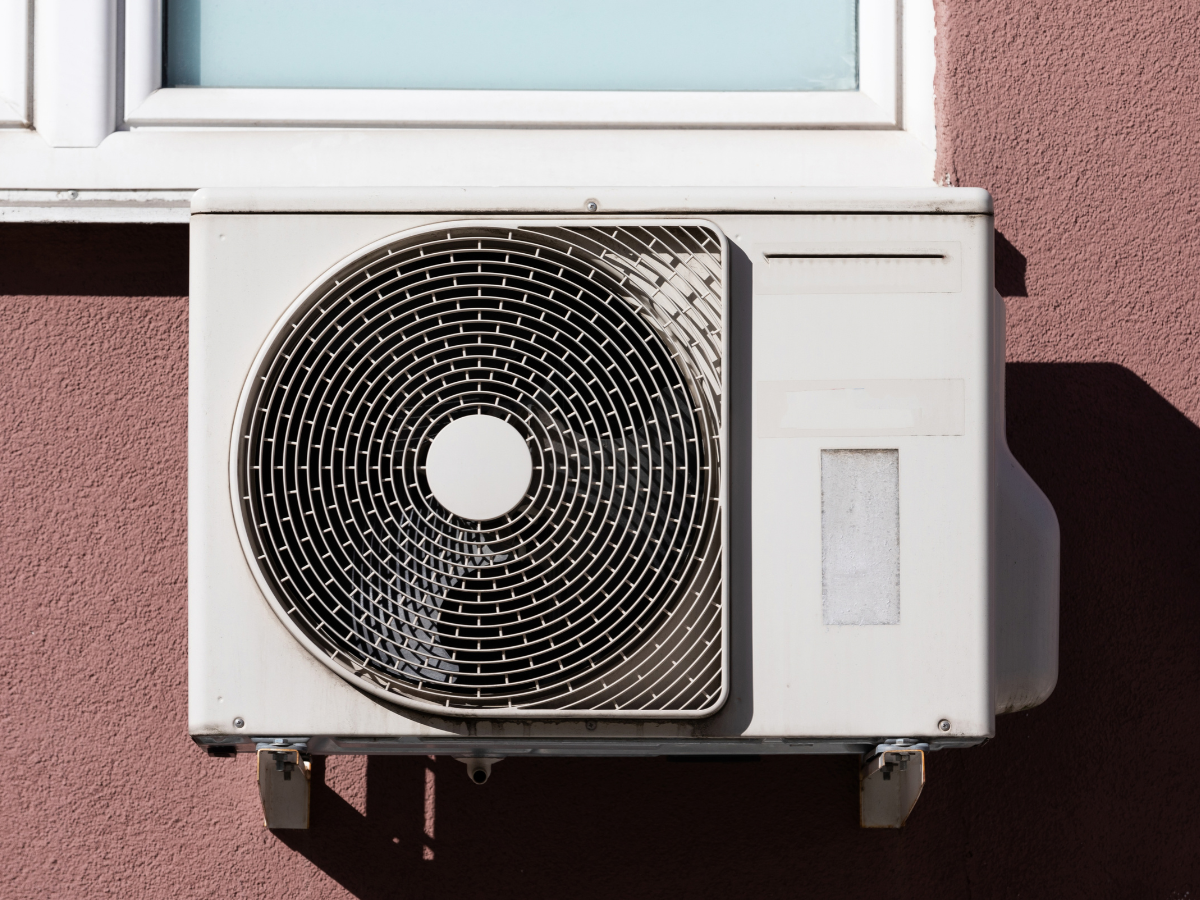 Outdoor heat pump unit installed on the exterior of a California home