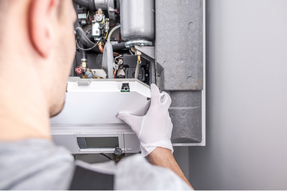 HVAC technician inspecting heating system components to diagnose furnace problems and restore reliable heat.