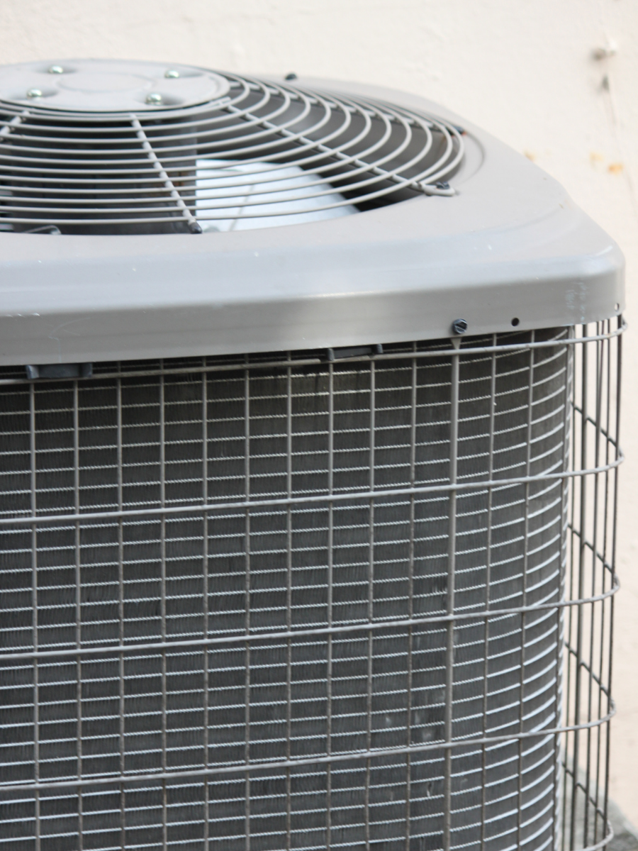 Close-up of a residential central air conditioning condenser Keep