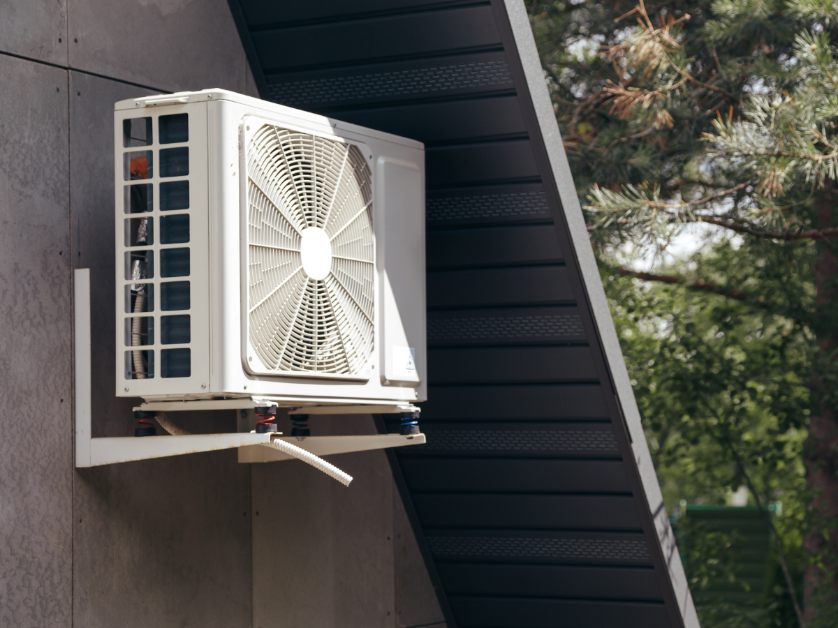 Outdoor ductless mini-split heat pump unit installed on a home