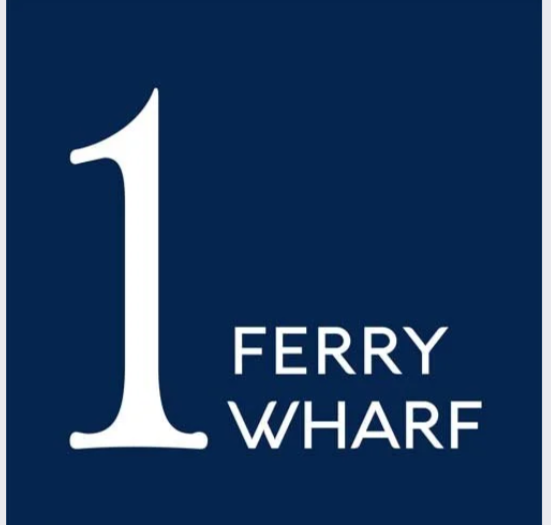 Sign with large number 1 and the text 'Ferry Wharf' on a dark blue background