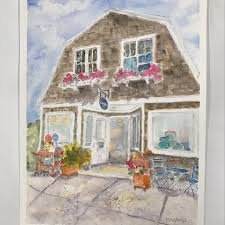 Watercolor painting of a two-story house with flower boxes under the windows, a small outdoor seating area with chairs and potted plants, and a sidewalk in front.