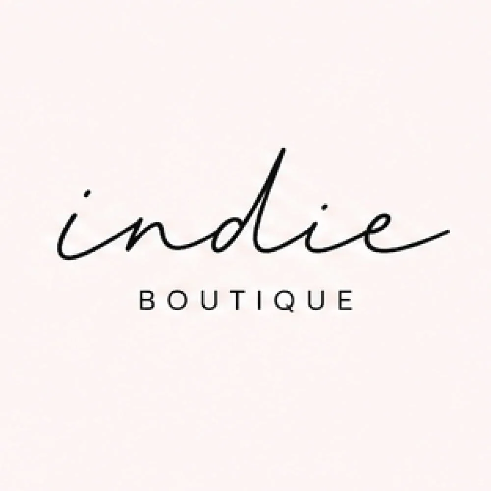Logo for indie boutique with the word 'indie' in black cursive and 'BOUTIQUE' in uppercase below.