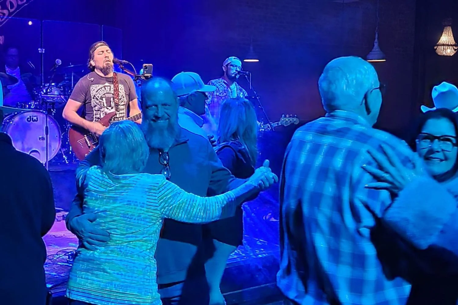 Jeff Jabos belting out tunes in front of a crowded dance floor