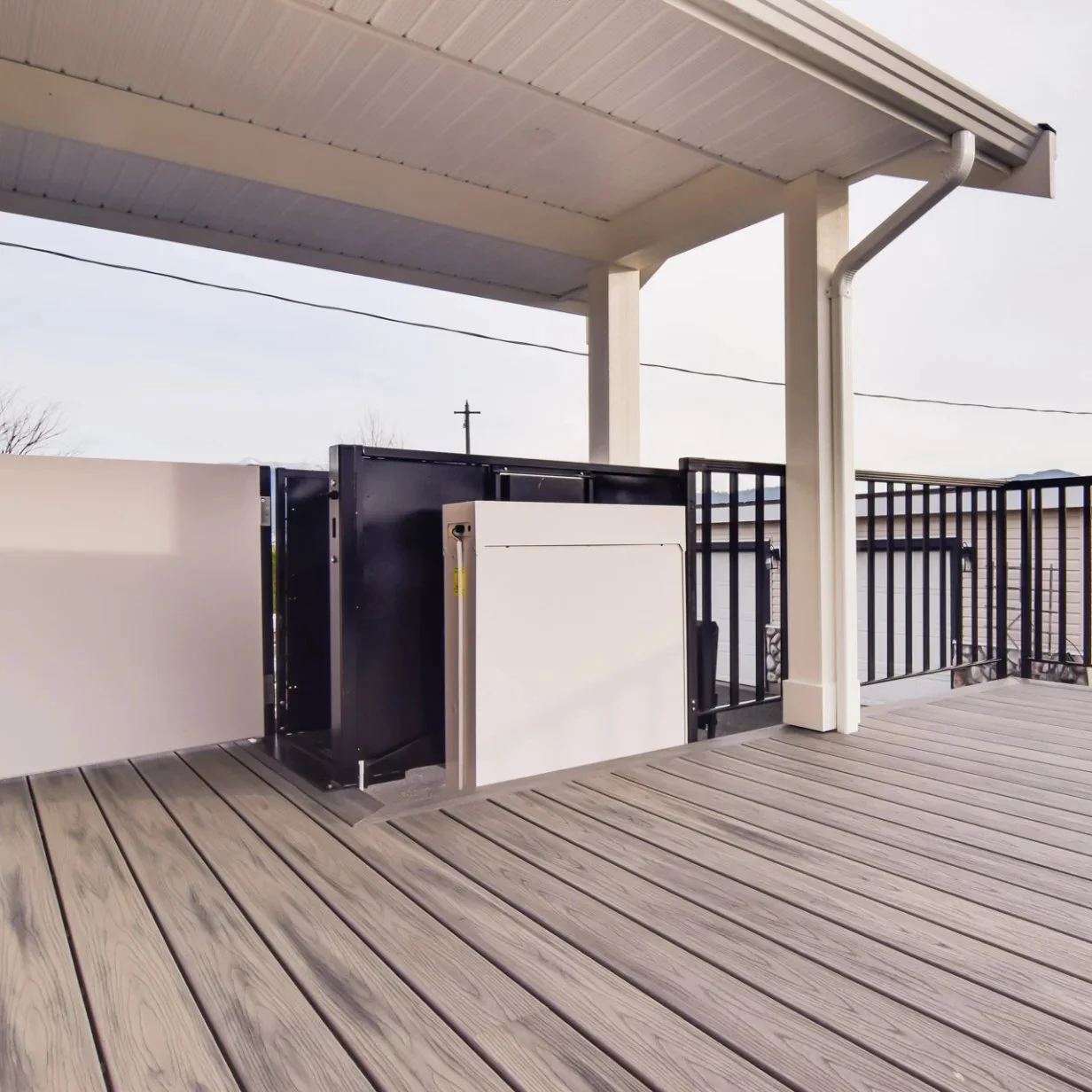 A Butler Mobility - RAM Trus-T vertical platform lift, view from the upper level of a residential porch