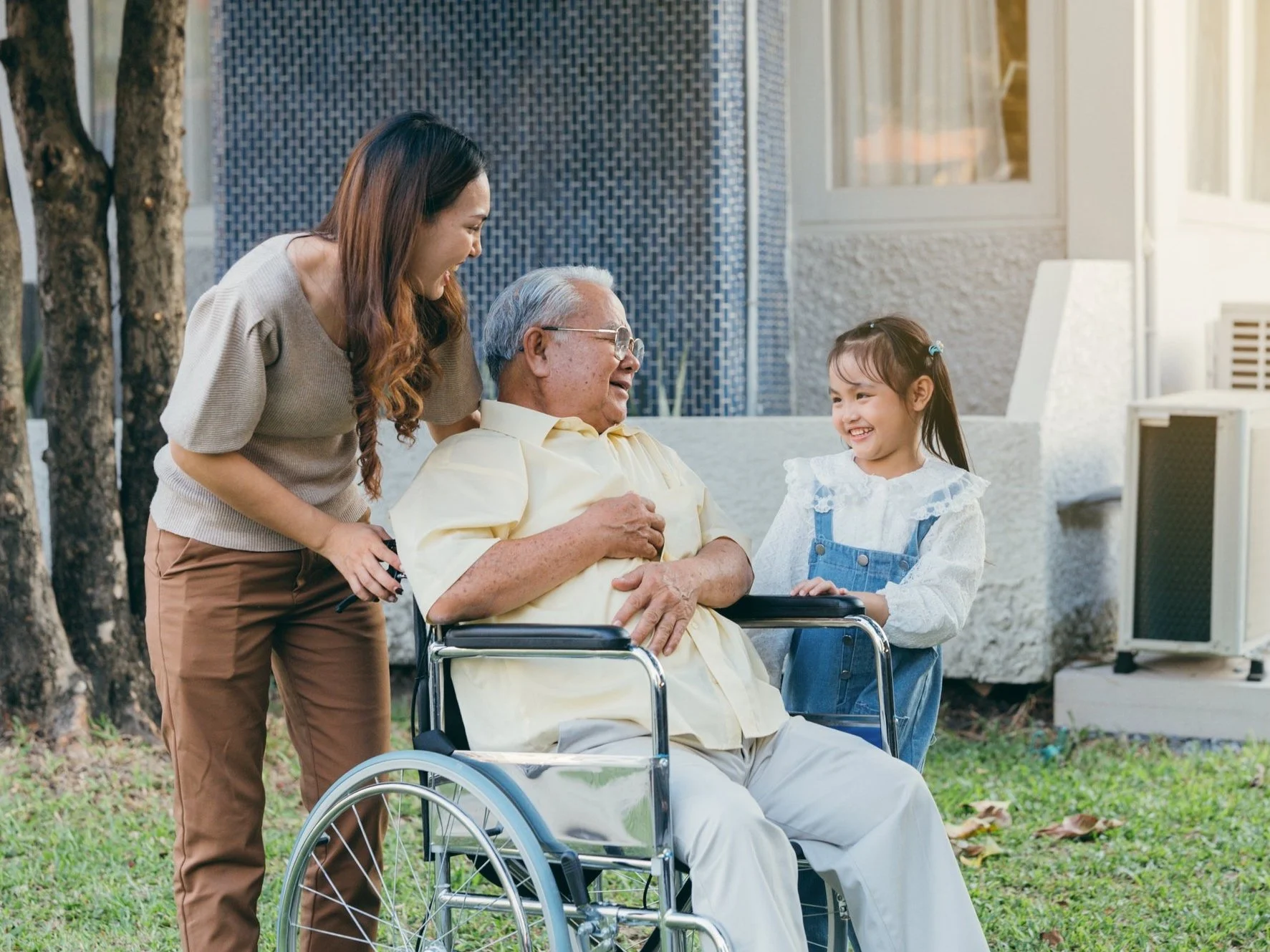 Butler Mobility-Happy family together with grandfather in wheelchair