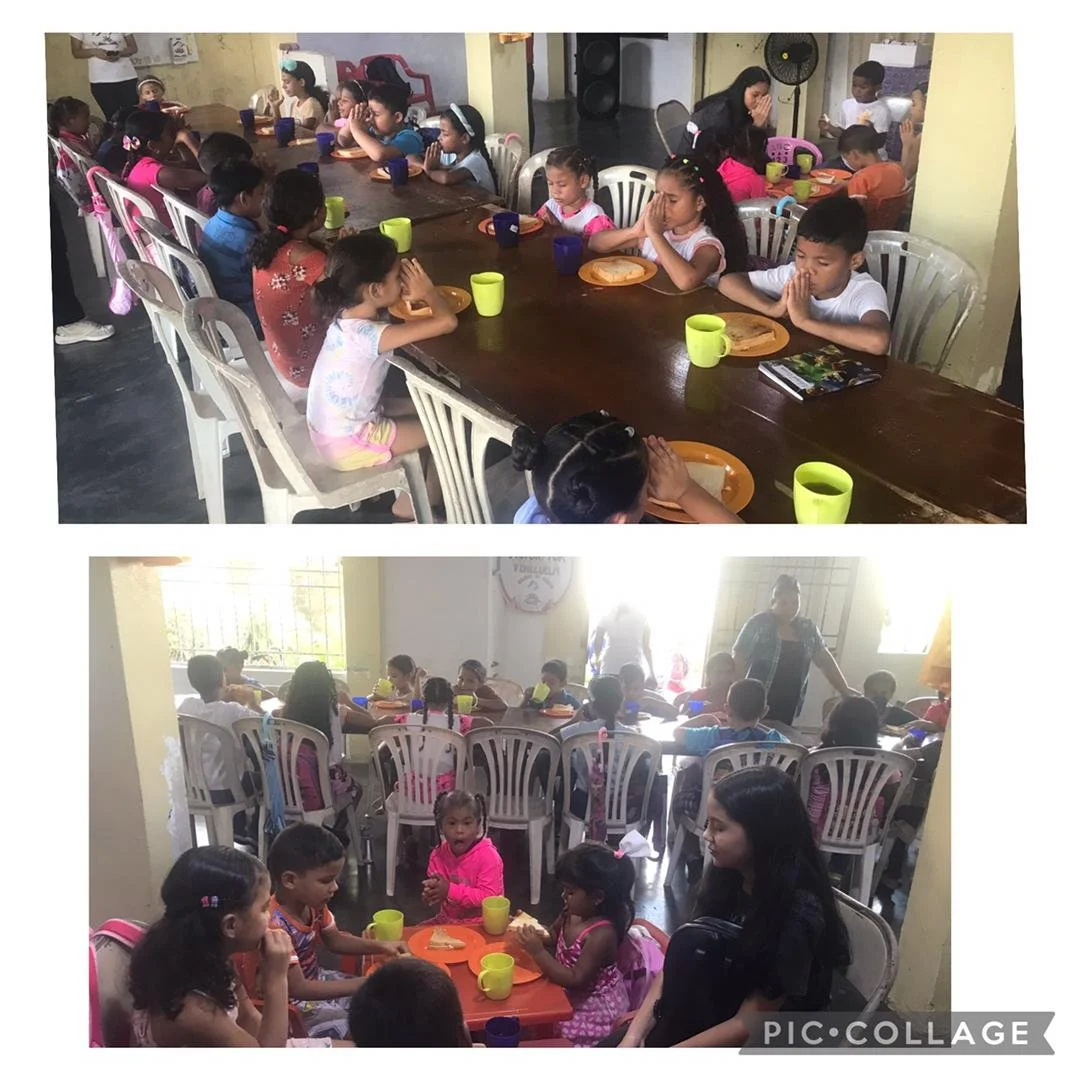 Kids receiving physical food and the word of God