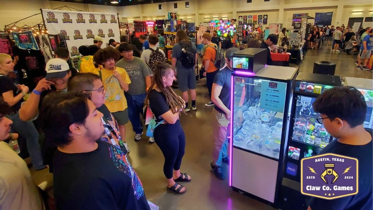 A crowd of people look on as players attempt to win Pokemon card prize capsules.  (Classic Game Fest. 2025)